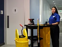 Image of a women with cleaning tools